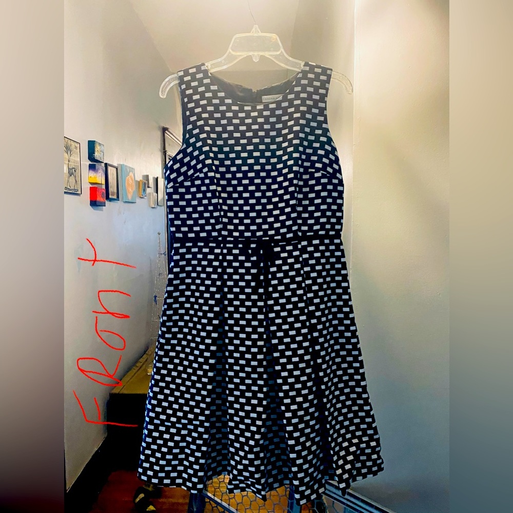 Retro style Black and white high waist sleeveless dress with pleated bottom.